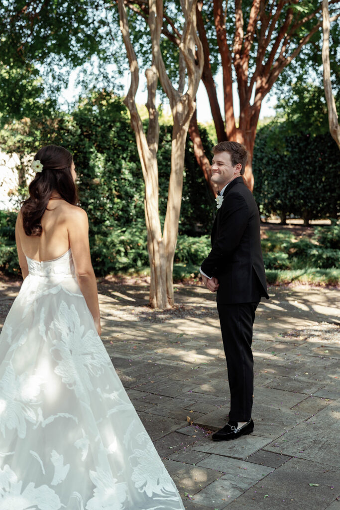 First look surrounded by spring blooms at the Dallas Arboretum, captured by luxury Dallas wedding photographer Megan Kay.