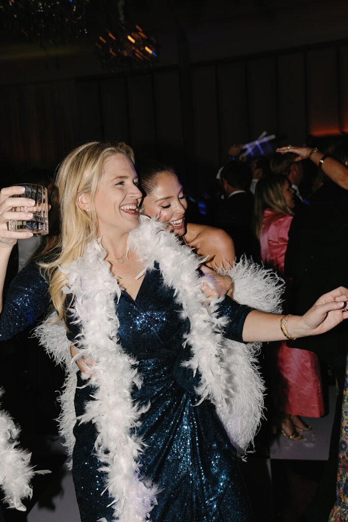 Guests dancing under twinkling lights at The St. Regis Longboat Key wedding reception with luxury décor and joyful energy.