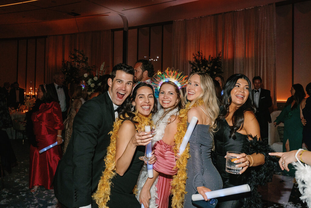 Guests dancing under twinkling lights at The St. Regis Longboat Key wedding reception with luxury décor and joyful energy.