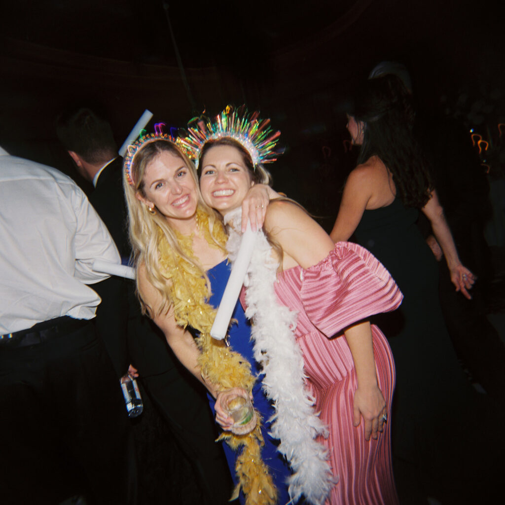 Guests dancing under twinkling lights at The St. Regis Longboat Key wedding reception with luxury décor and joyful energy.
